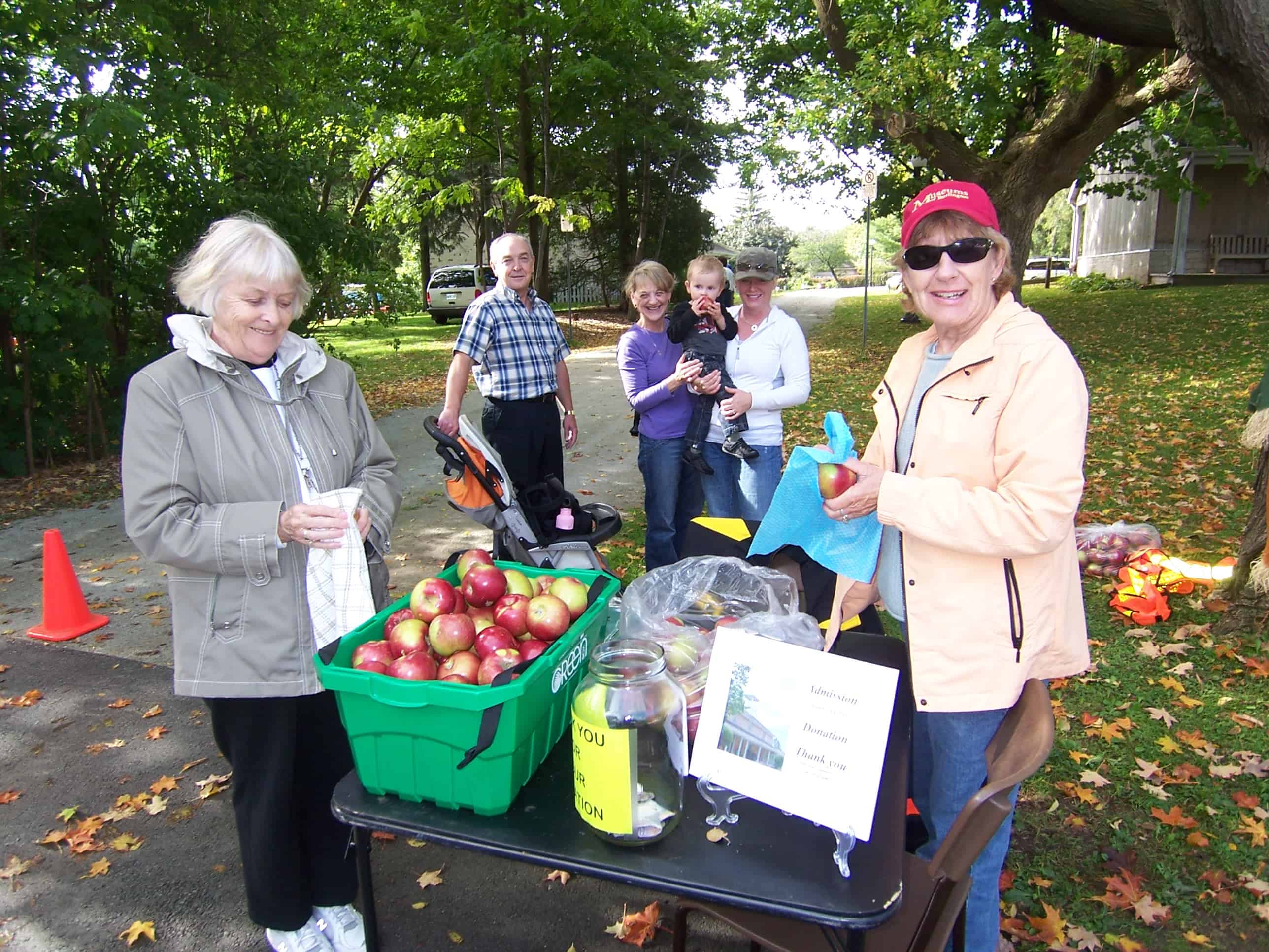 Ladies giving out apples at Ireland House