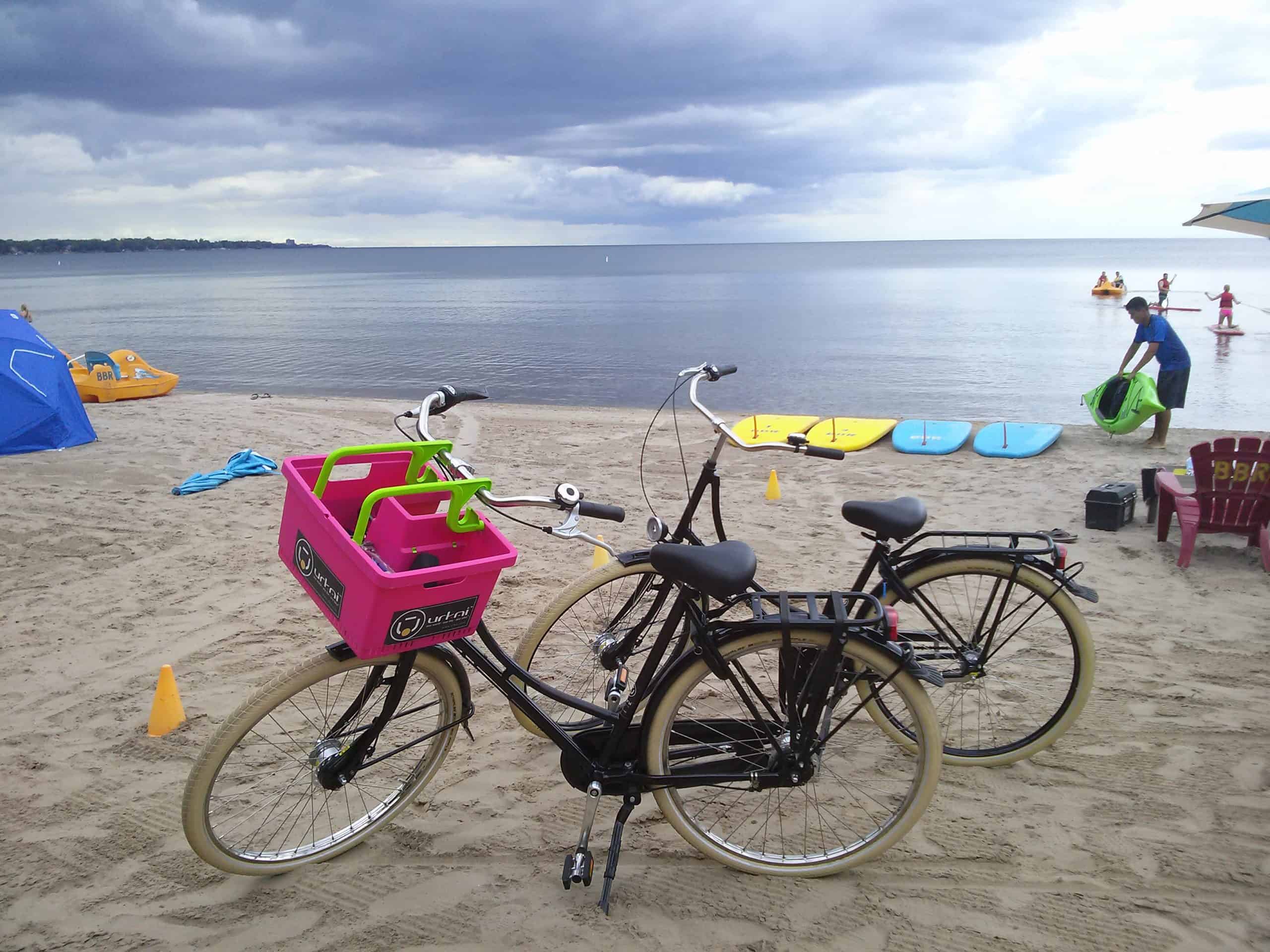 Bikes stopped at Beachway Park Burlington with paddle boards and lake in background