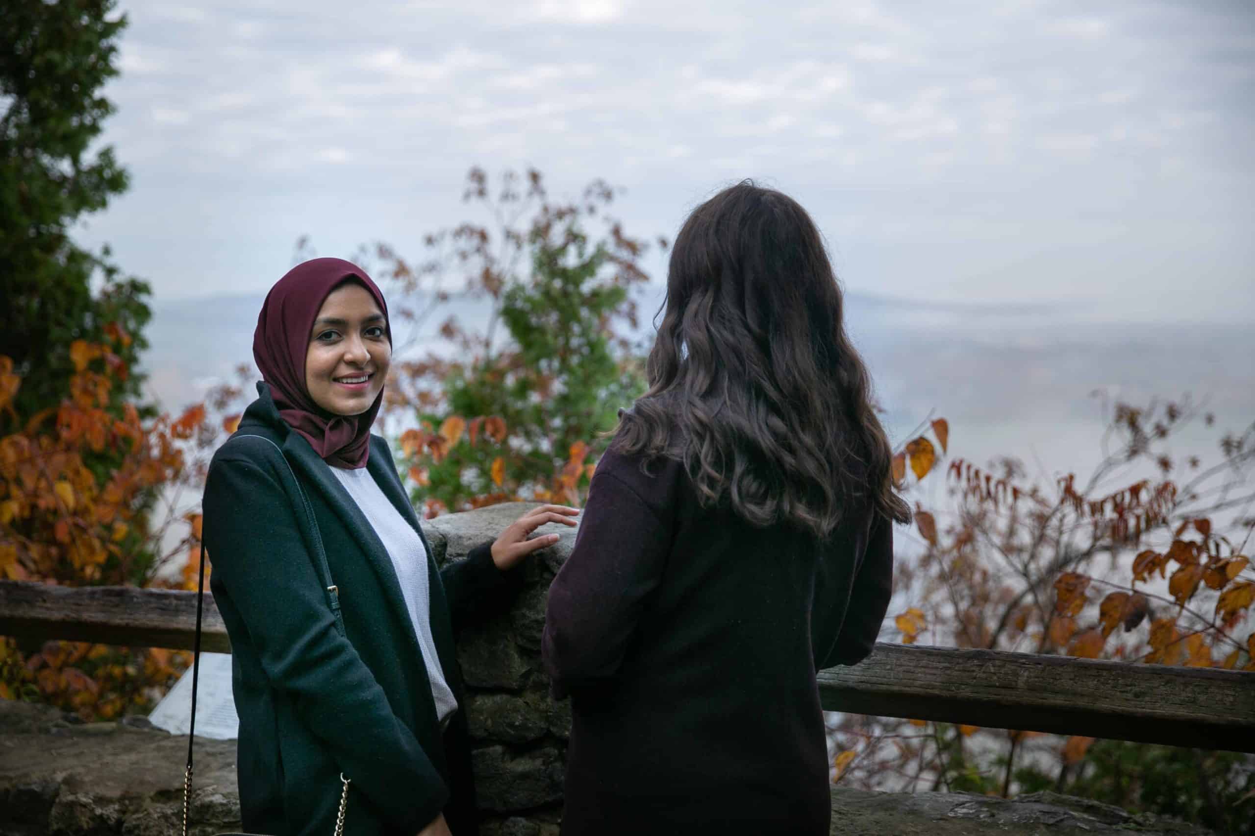Young women looking out over mist at Mount Nemo