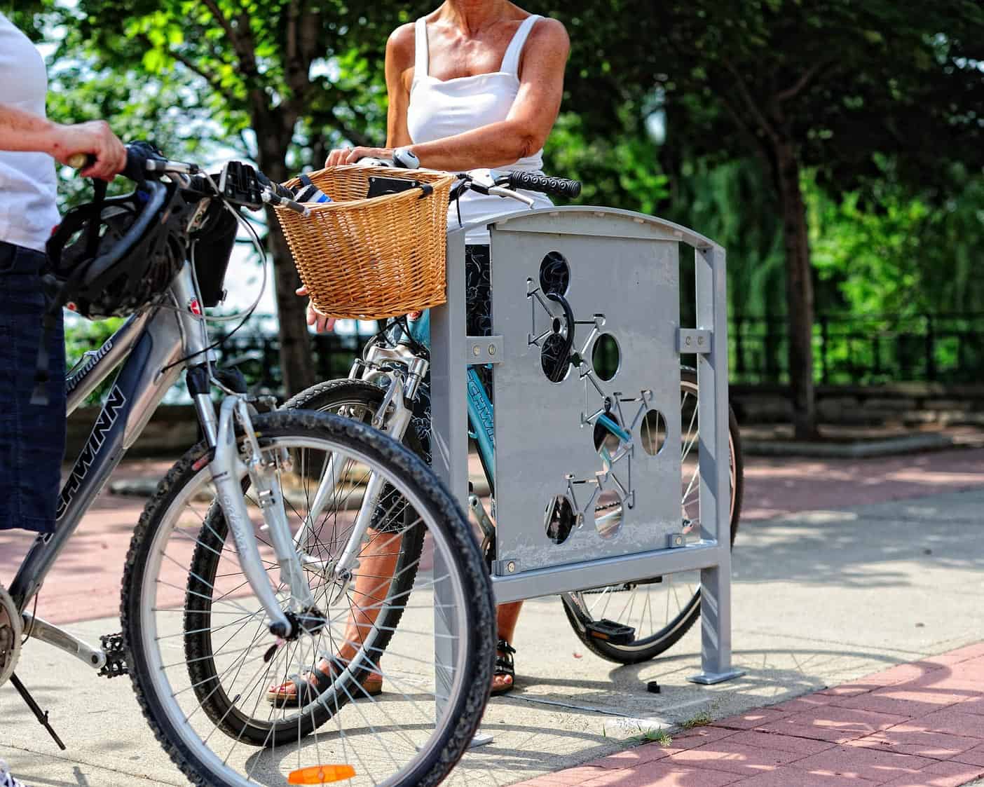 Bike racks with cyclists setting up bikes