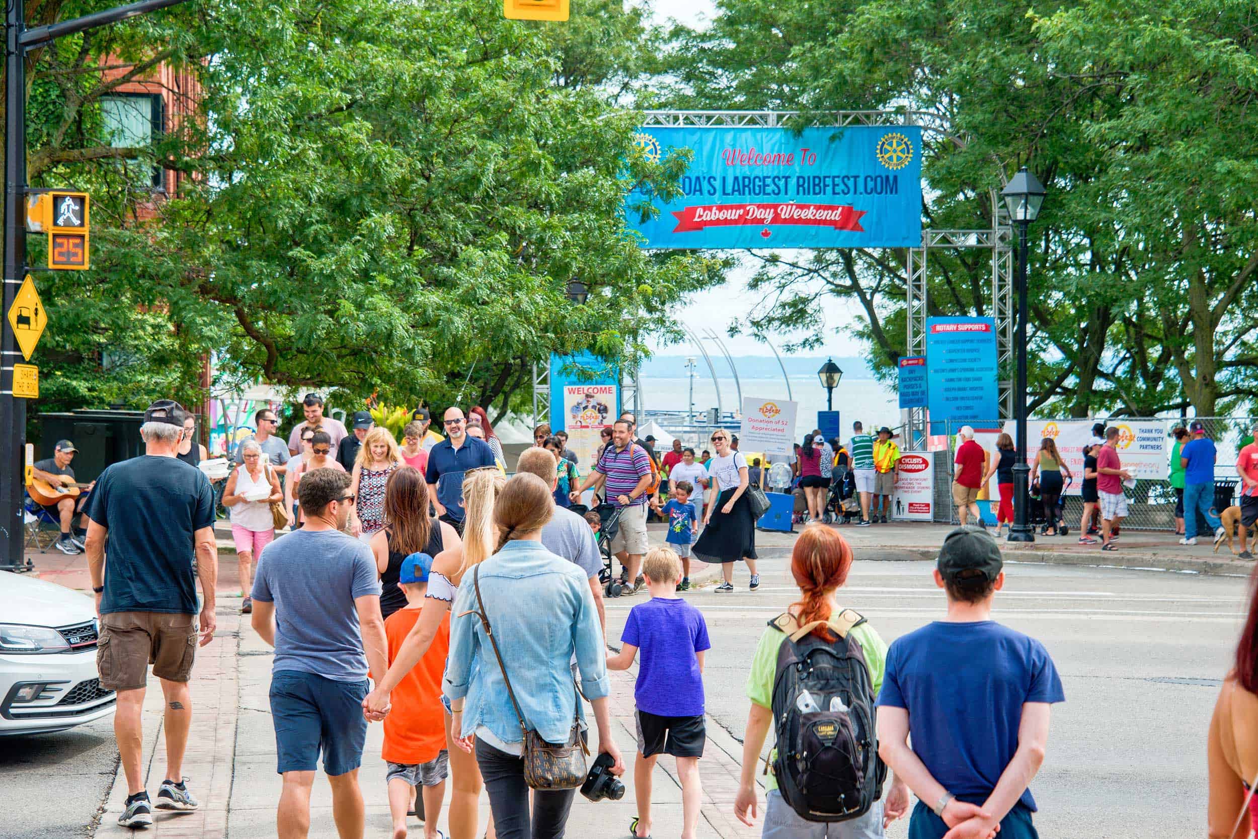 Ribfest entrance with people walking down into park