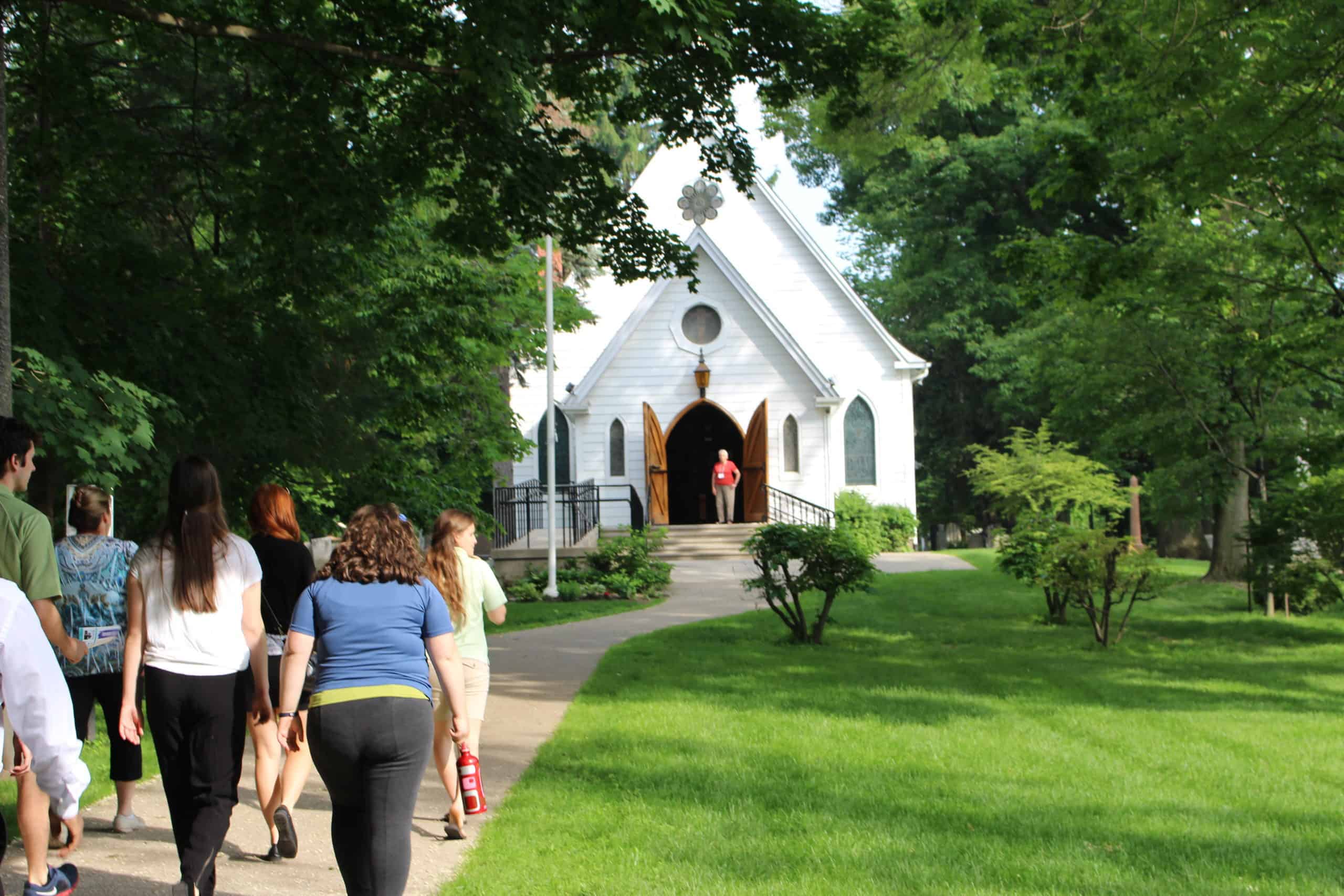 Ambassador training participants walking up to St. Luke`s church