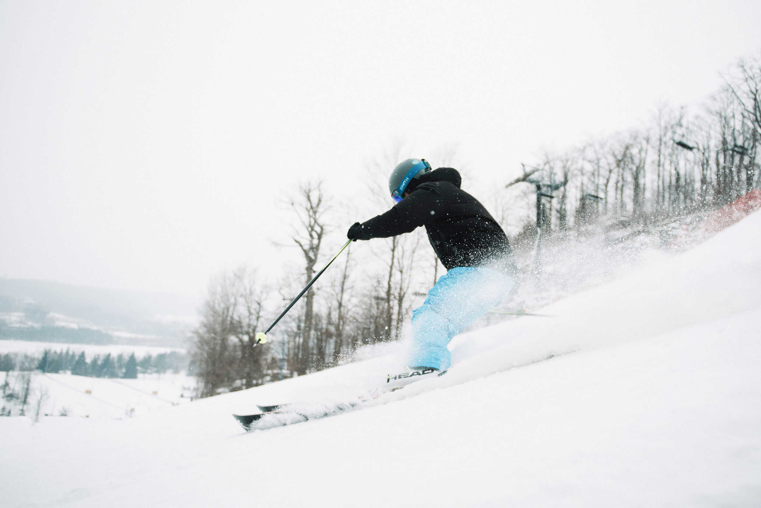 Skier flying down the slopes at Glen Eden