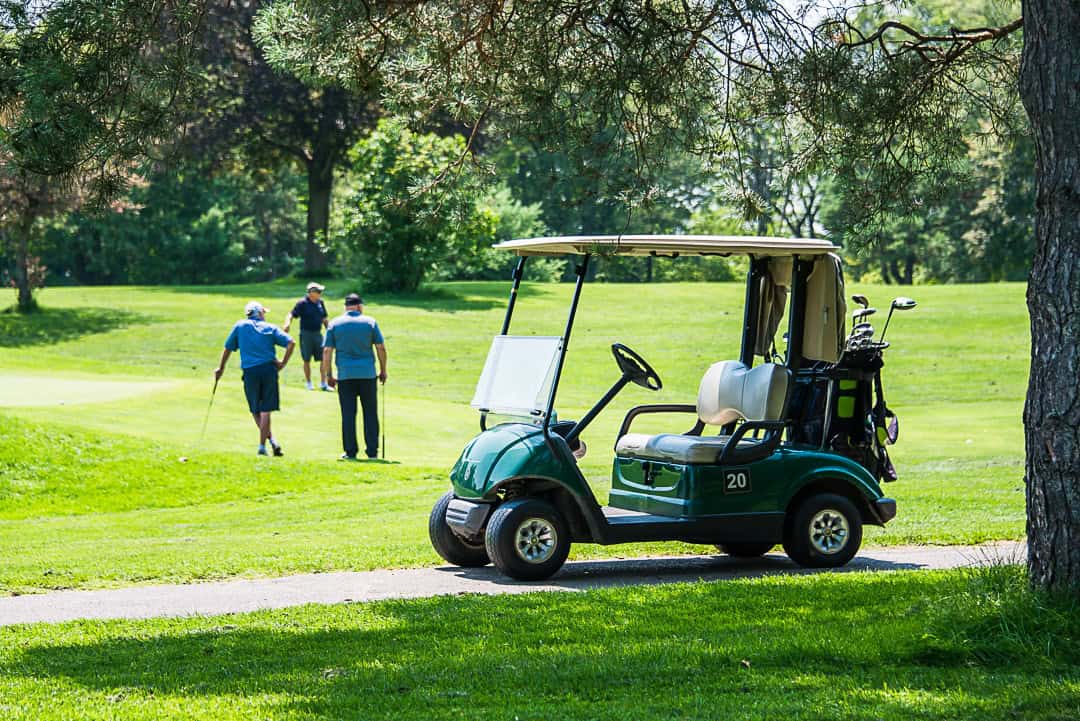 golf cart and players